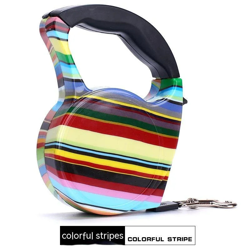 Retractable dog leash with colorful striped pattern, ergonomic black handle, durable plastic design