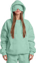 Woman wearing oversized mint green hoodie and sweatpants with matching eye mask, streetwear style