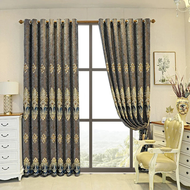 Luxury jacquard curtains with gold and blue damask pattern, fitted in an elegant living room.