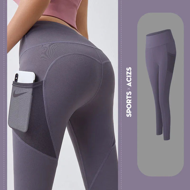 High-waisted purple athletic leggings with side pocket, seamless fit, stretch fabric.