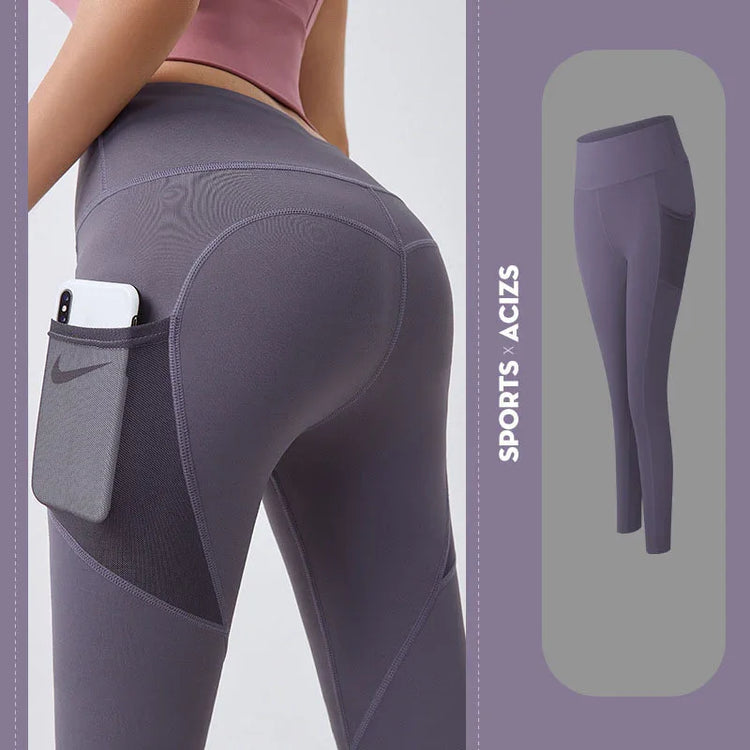 High-waisted purple athletic leggings with side pocket, seamless fit, stretch fabric.