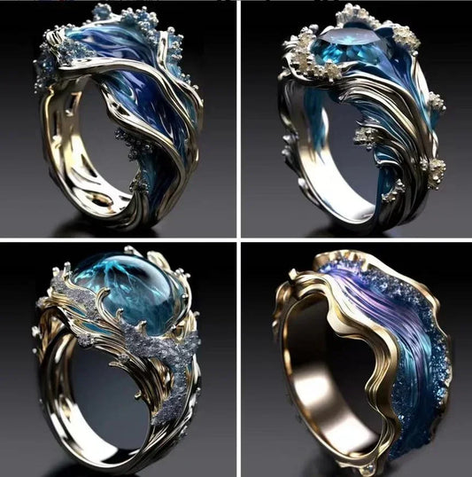 Unique silver and blue statement rings with wave-inspired, sculptural designs and crystal accents.