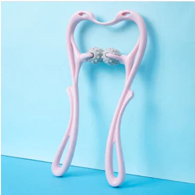 Pink plastic handheld massage roller with double textured wheels on a blue background