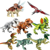 Assorted colorful plastic dinosaur figurines on white background, including Triceratops and T-Rex.