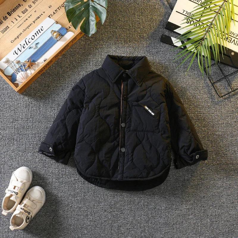 Black quilted jacket with button-up front, long sleeves, and relaxed fit for kids.