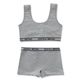 Grey cotton lounge set with sporty tank top and high-waisted shorts, elastic waistband.