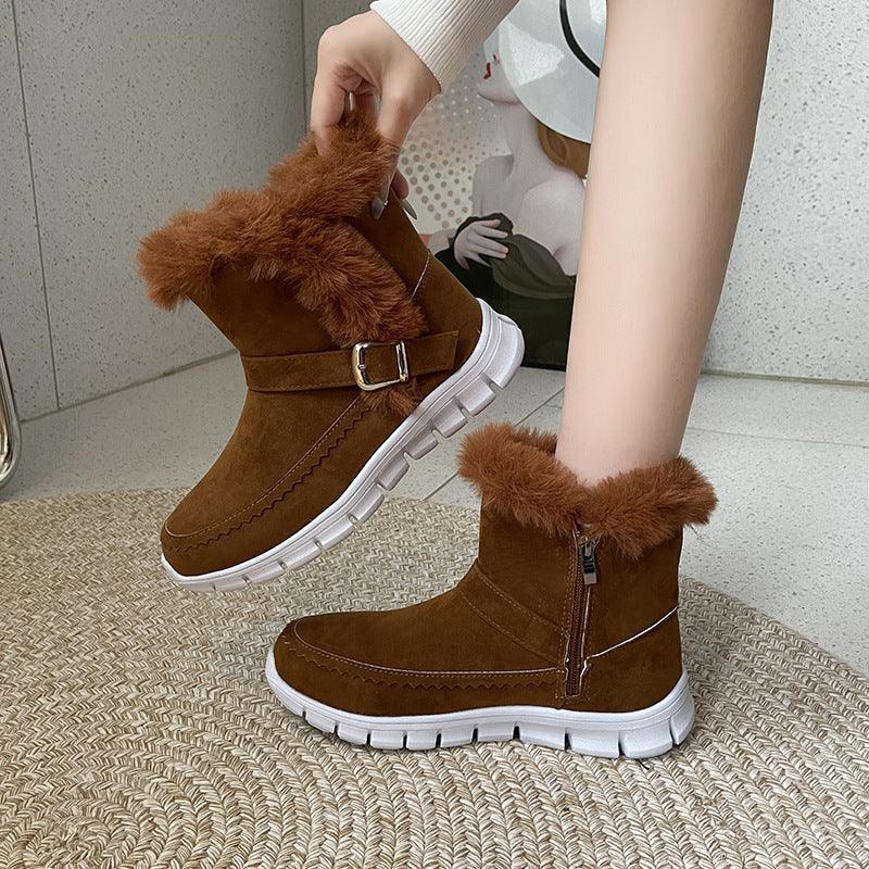 Brown faux fur-lined suede ankle boots with white rubber soles and buckle detail, cozy fit