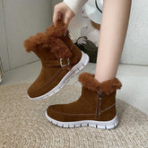 Brown faux fur-lined suede ankle boots with white rubber soles and buckle detail, cozy fit