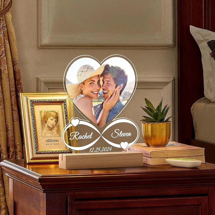 Heart-shaped acrylic photo lamp with couple image, engraved names and date, on wooden base