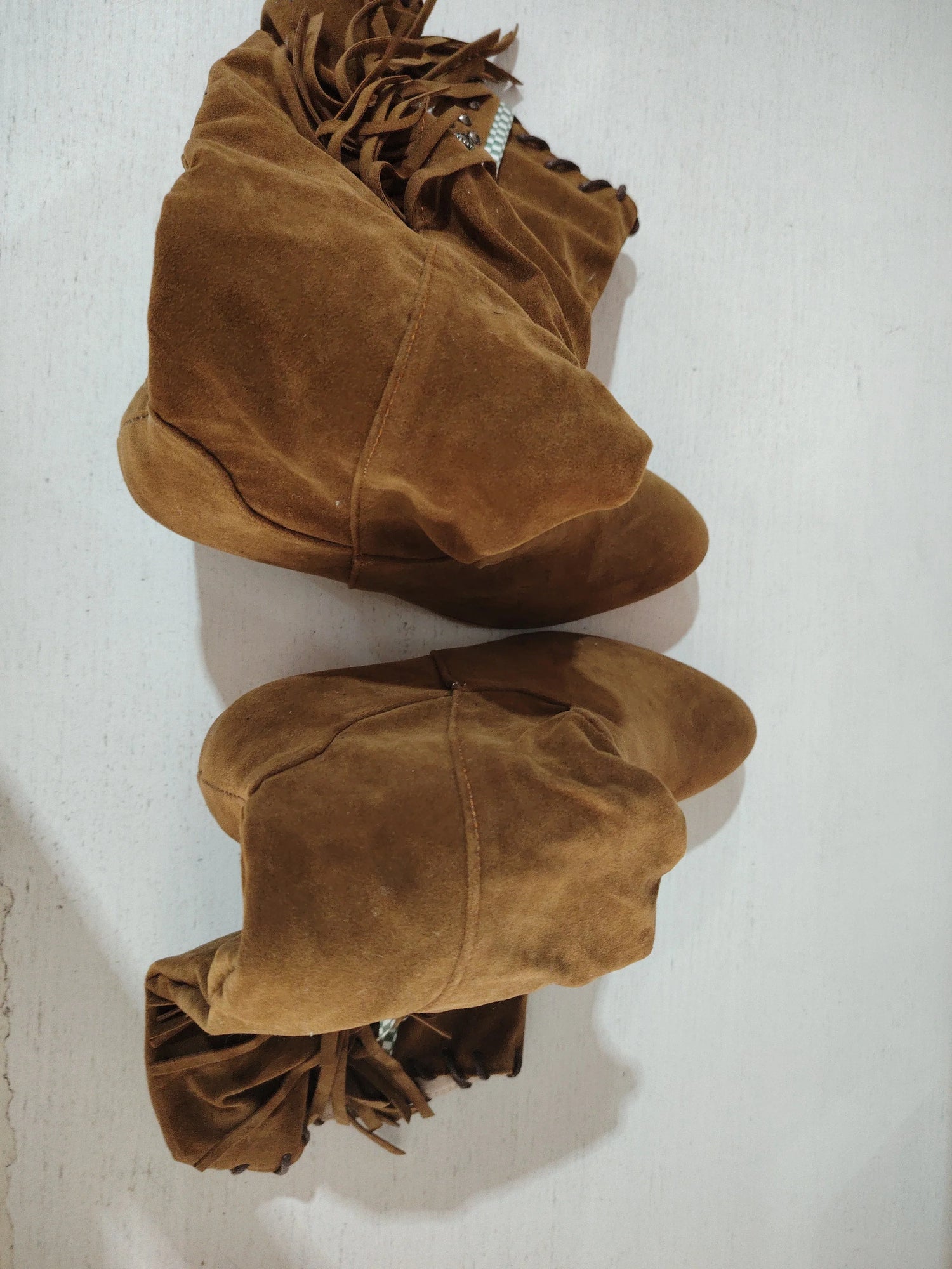 Brown suede boots with fringe detailing and relaxed fit