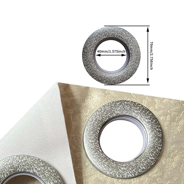 Silver textured curtain grommet ring on beige jacquard fabric, 40mm inner diameter.