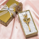 Gold-plated rose ornament in gift box on pink satin fabric