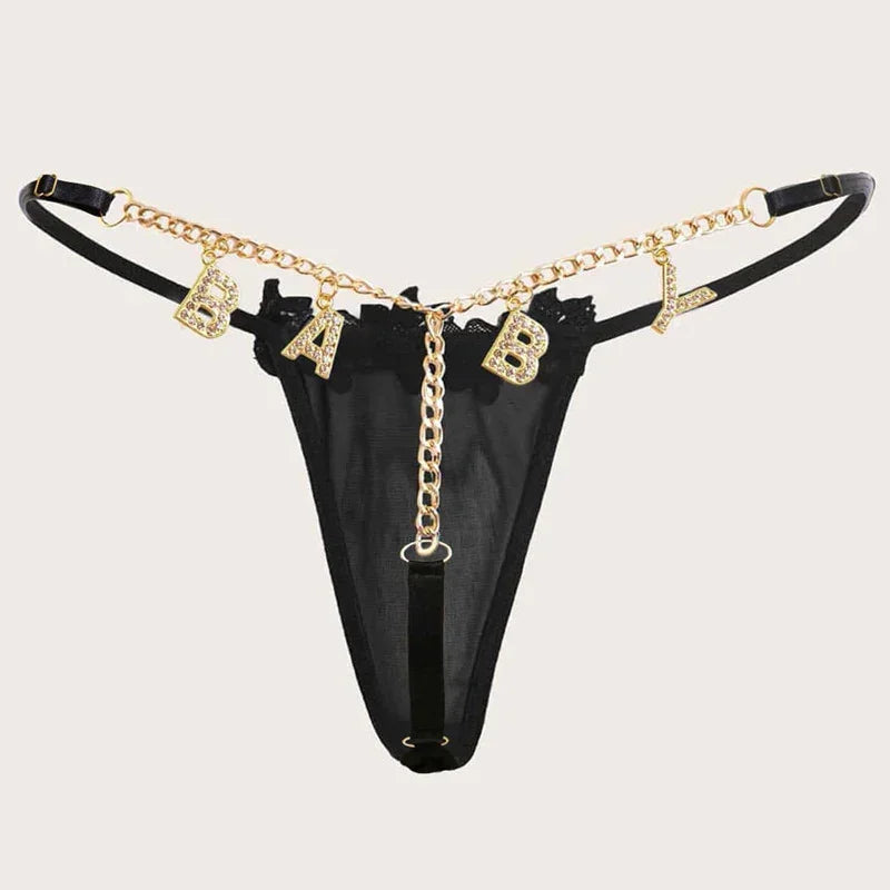 Black sheer thong with gold chain detail and rhinestone BABY lettering, adjustable straps