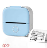 Light blue portable mini thermal printer with white trim printing a black and white bus image