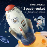 White and red toy rocket with water jet, cartoon astronaut, and space theme background