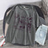 Oversized grey graphic t-shirt with abstract purple prints, paired with light denim shorts