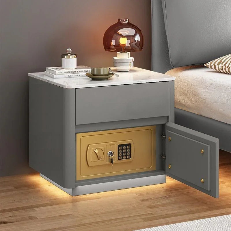 Modern gray nightstand with marble top, built-in gold safe, and soft ambient lighting