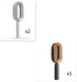 Two light gray and one brown oval hair brushes with ergonomic handles, modern design
