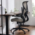 Modern ergonomic mesh office chair with gray cushioned seat and black frame at a minimalist desk