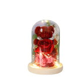 Red rose and bear flower arrangement in glass dome with LED lights, wooden base