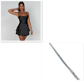 Woman in a fitted black satin mini dress with square neckline and flared skirt, silver bracelet accessory
