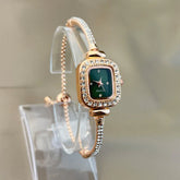 Elegant rose gold bracelet watch with green square face and crystal accents, slim fit