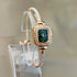 Elegant rose gold bracelet watch with green square face and crystal accents, slim fit