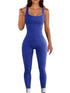 Woman wearing a fitted blue ribbed sleeveless jumpsuit with square neckline.