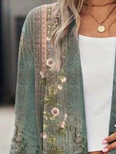 Green floral kimono cardigan with loose fit over white ribbed tank top