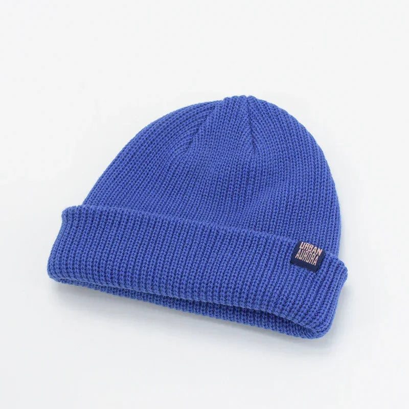 Blue ribbed knit beanie with cuff, soft texture, modern streetwear style, relaxed fit