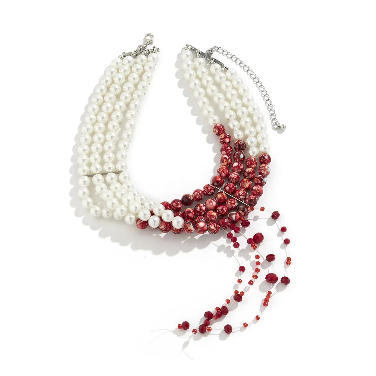 Statement necklace with multi-strand white pearls and red marbled beads on silver chain