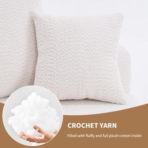White crochet yarn pillow with plush cotton filling on minimalist couch setting