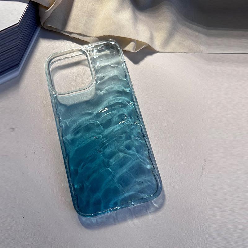 Glossy blue gradient phone case with wavy textured pattern, hard plastic material