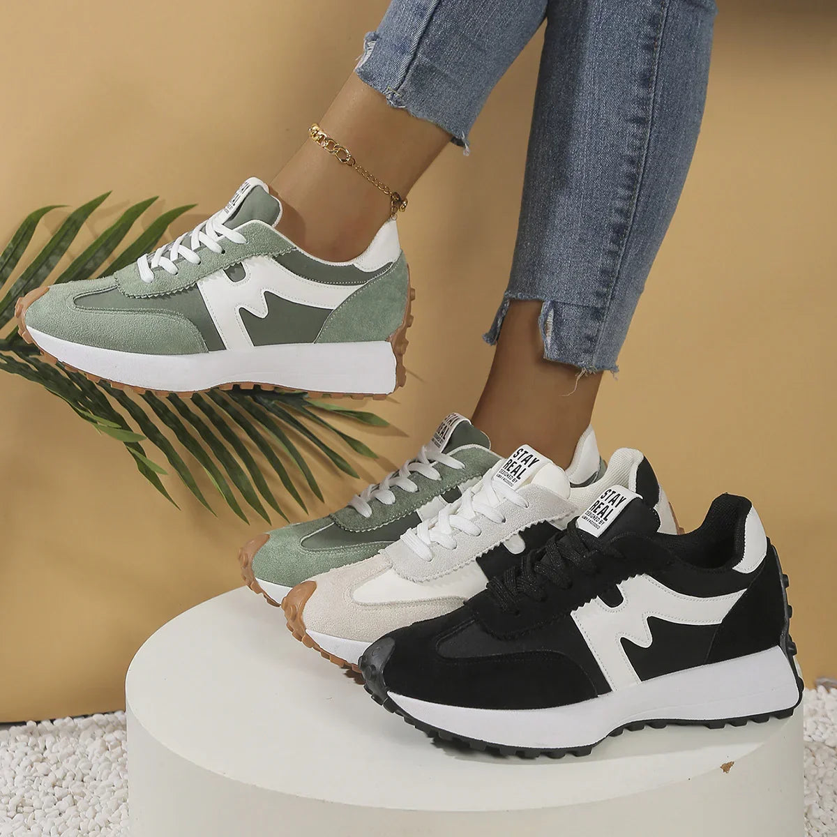 Casual suede sneakers in green, beige, and black with chunky sole and relaxed fit