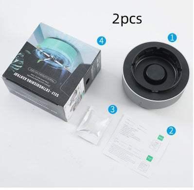 Set of two automatic self-stirring mugs in black and silver with instructions and packaging.