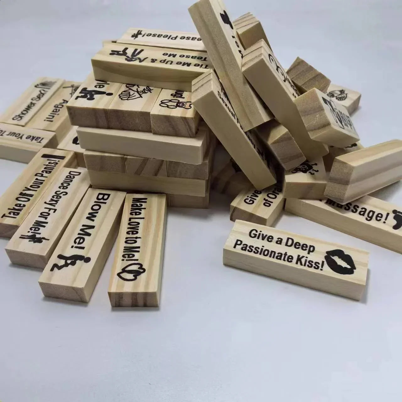 Stack of wooden game blocks with playful romantic messages, natural wood color, casual style.