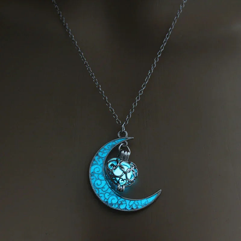 Silver chain necklace with glowing blue crescent moon and ornate heart pendant, modern streetwear accessory