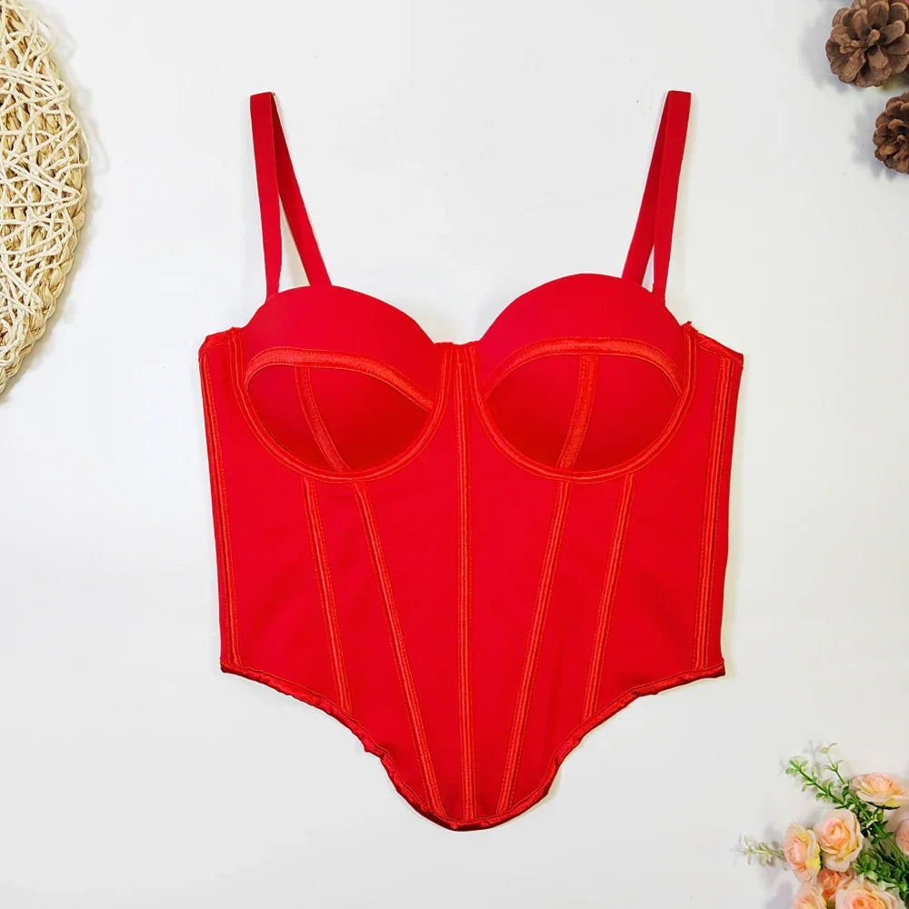 Red structured corset bodysuit with spaghetti straps and defined seams, laid flat.