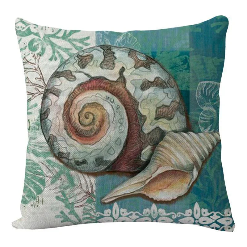 Decorative pillow with seashell and ocean-themed print in blue and green tones