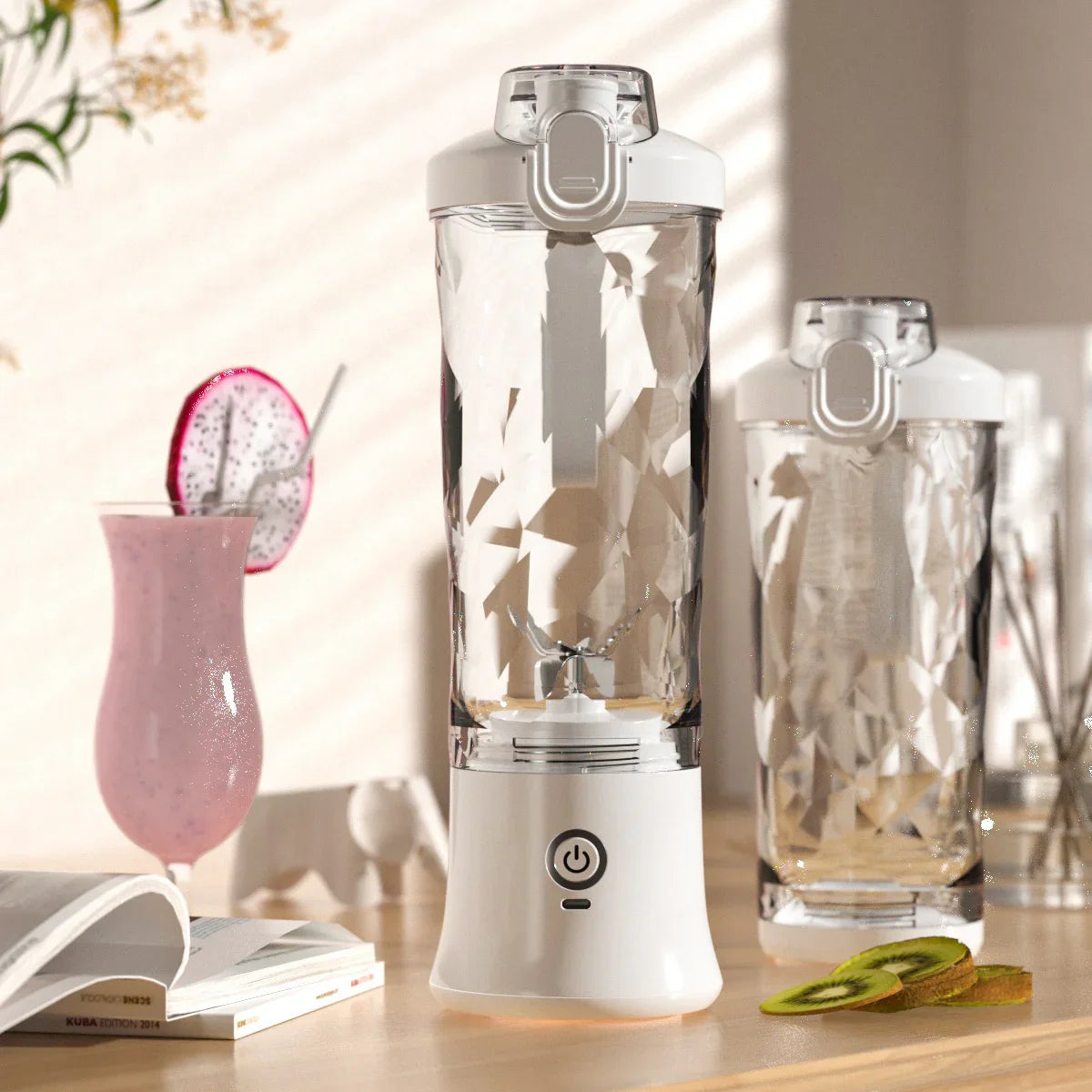 Portable white blender with faceted glass design, modern style, on a kitchen counter