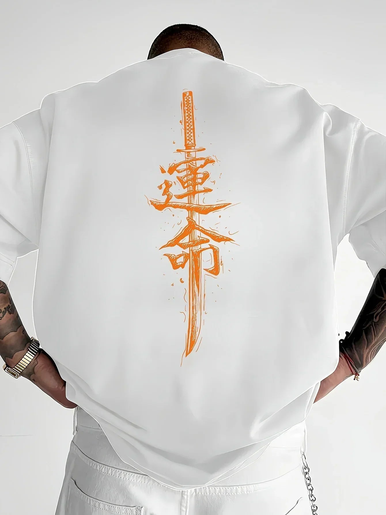 Oversized white short sleeve shirt with orange Japanese sword and kanji graphic on back