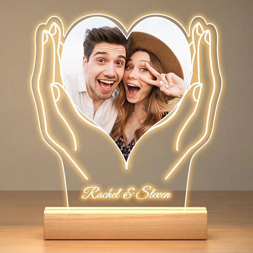 Custom LED night light with heart-shaped photo, wooden base, and glowing hand outline