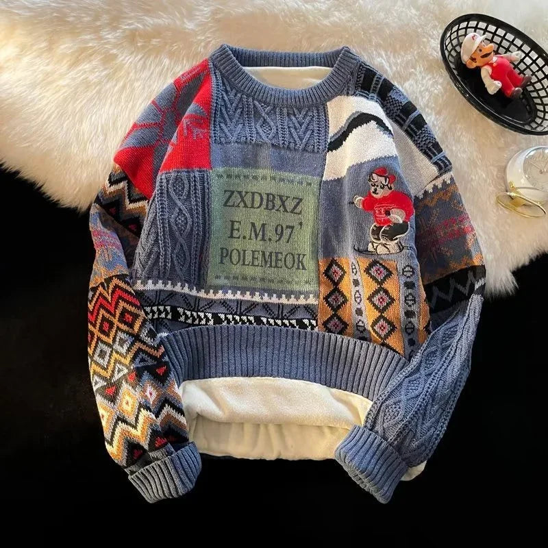 Colorful patchwork knit sweater with mixed patterns, cartoon graphic, and relaxed fit.