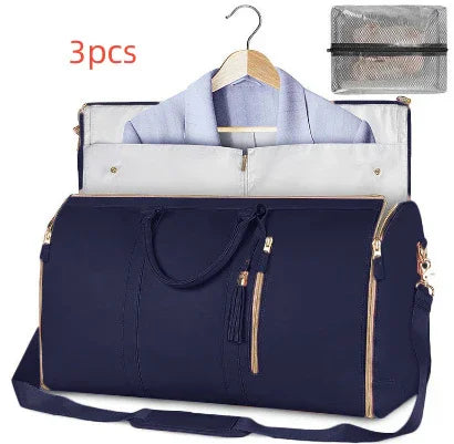 Navy blue travel duffel bag with gold zippers, garment compartment, and matching accessory pouch.