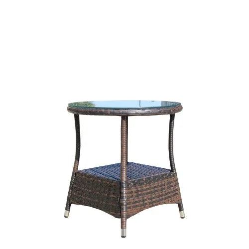 Round glass top side table with brown wicker frame and lower shelf, modern outdoor furniture.