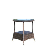 Round glass top side table with brown wicker frame and lower shelf, modern outdoor furniture.