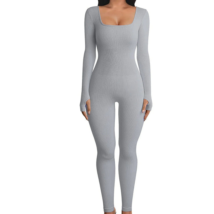 Fitted ribbed grey jumpsuit with long sleeves, square neckline, and stretchy material.