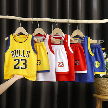 Assorted kids basketball jersey sets in yellow, red, white, and blue, sleeveless, mesh fabric.