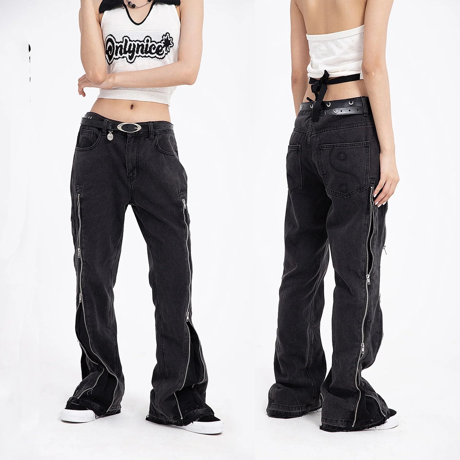 Loose fit black denim pants with side zippers, straight-leg cut, worn by a model.