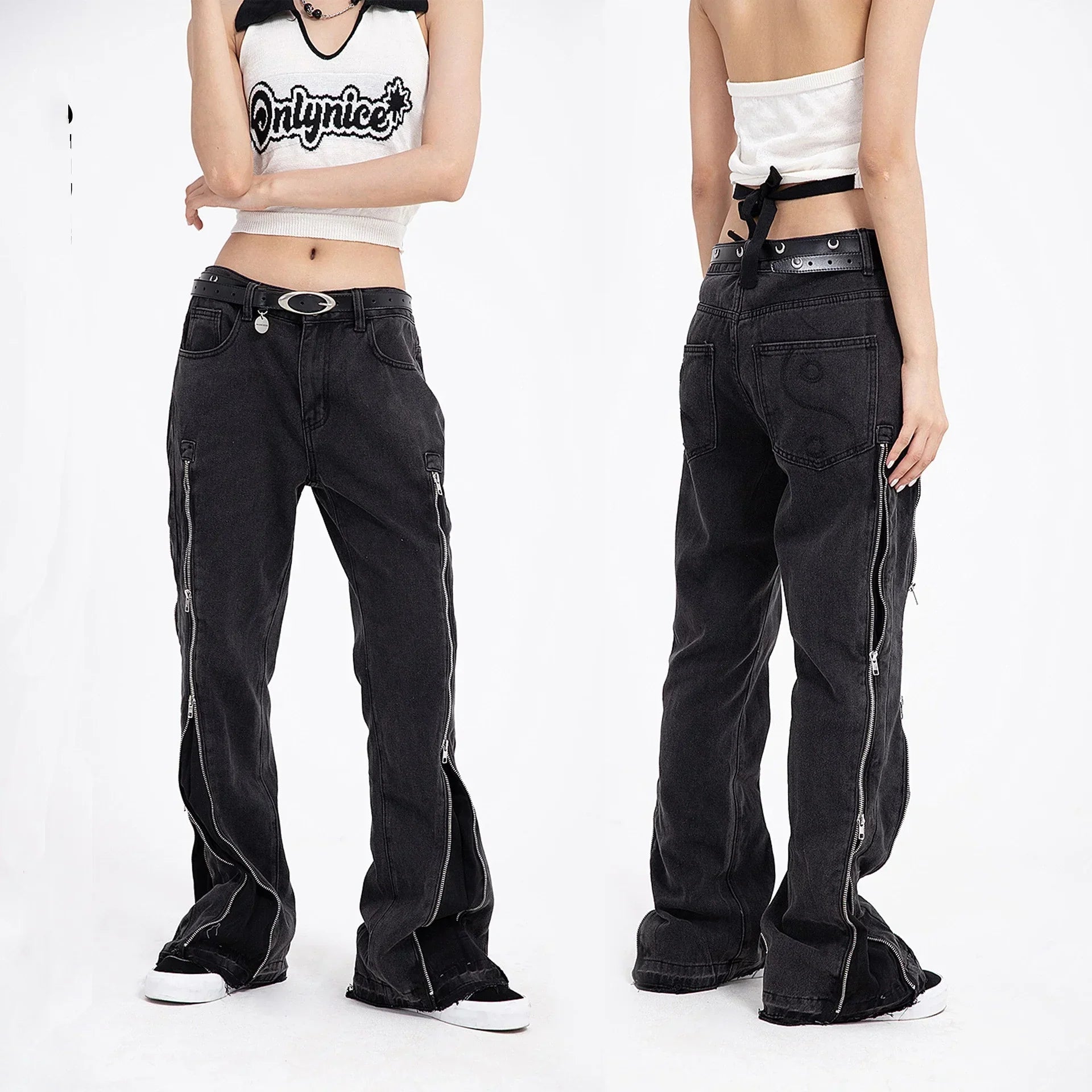 Loose fit black denim pants with side zippers, straight-leg cut, worn by a model.